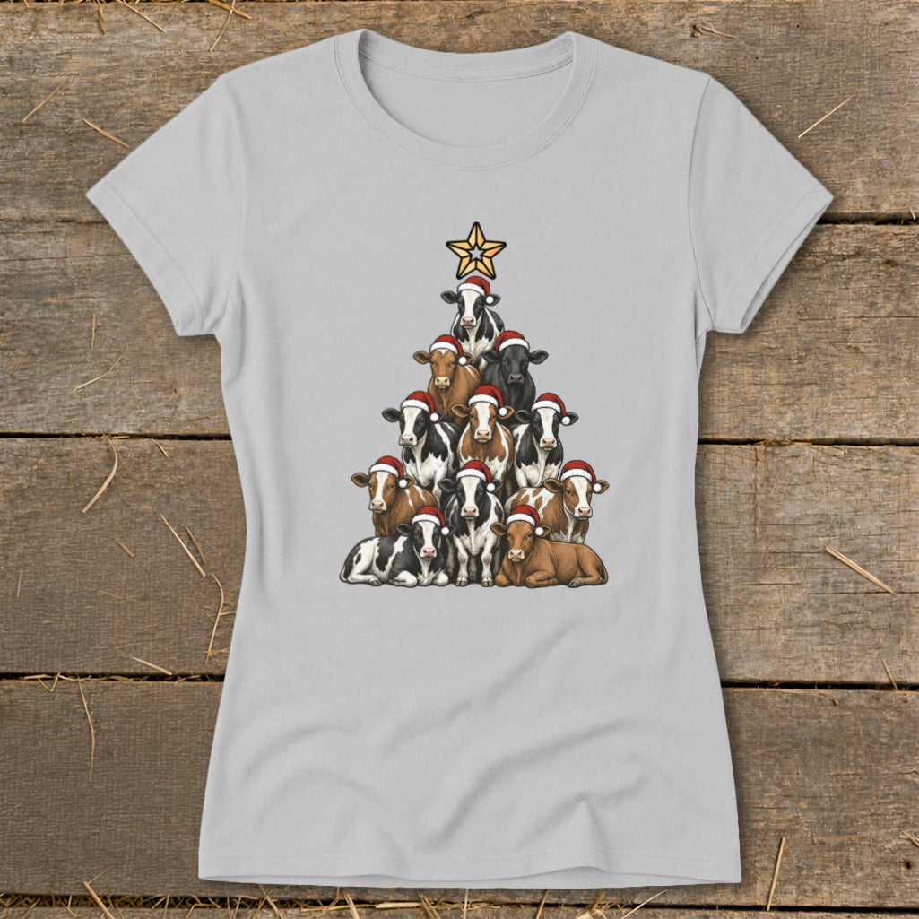 Christmas tree formed by cows wearing Santa hats with a star on top.