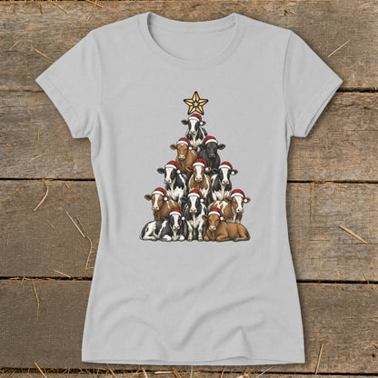 Christmas tree formed by cows wearing Santa hats with a star on top.