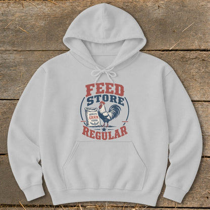 White hoodie with "Feed Store Regular" text and a rooster graphic.