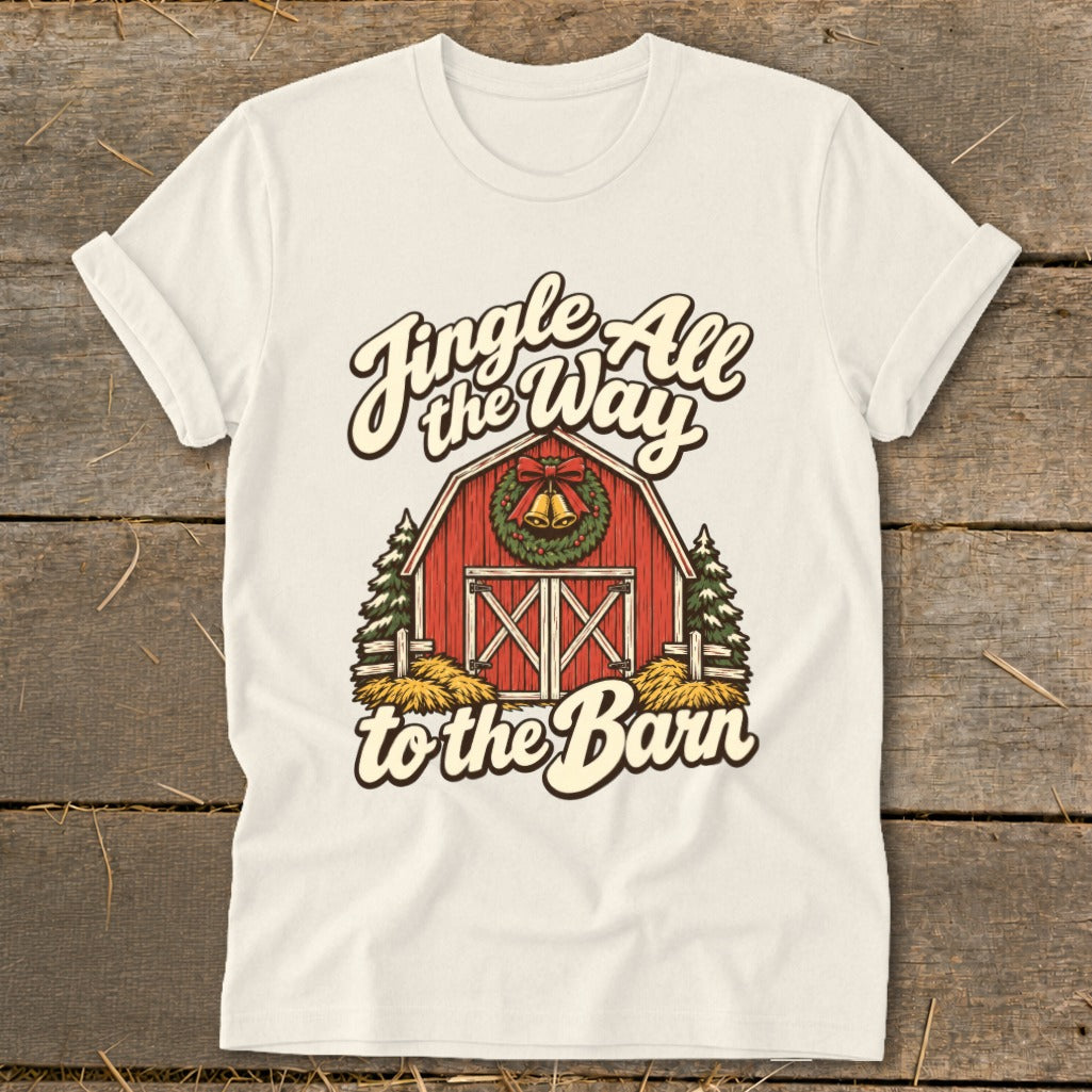 T-shirt with red barn, wreath, bells, and text "Jingle All the Way to the Barn."