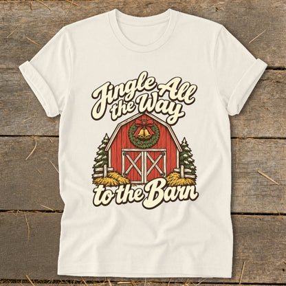 T-shirt with red barn, wreath, bells, and text "Jingle All the Way to the Barn."