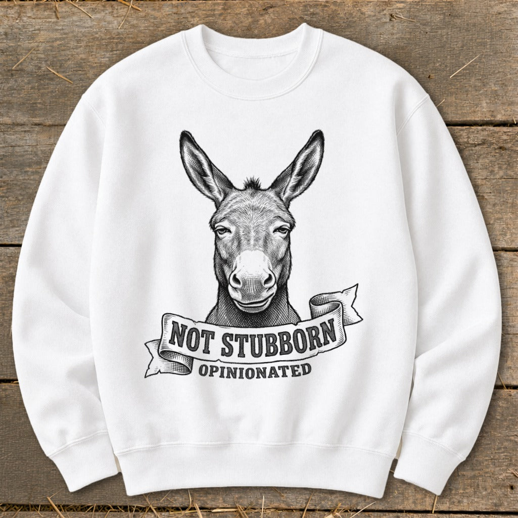 White sweatshirt with a black and white drawing of a donkey head above text reading "NOT STUBBORN OPINIONATED".