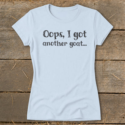 Light blue t-shirt with "Oops, I got another goat..." text.