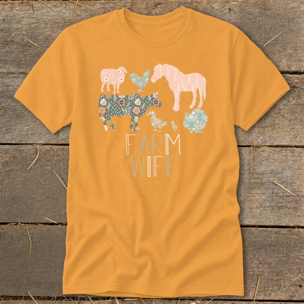Orange t-shirt with a "FARM WIFE" graphic featuring stylized farm animals.