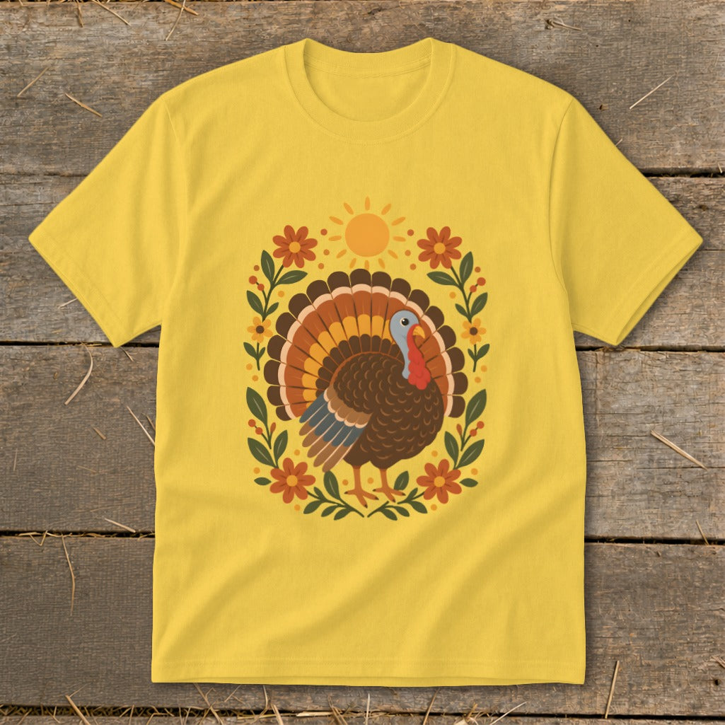Yellow t-shirt with a colorful turkey and floral design in the center.