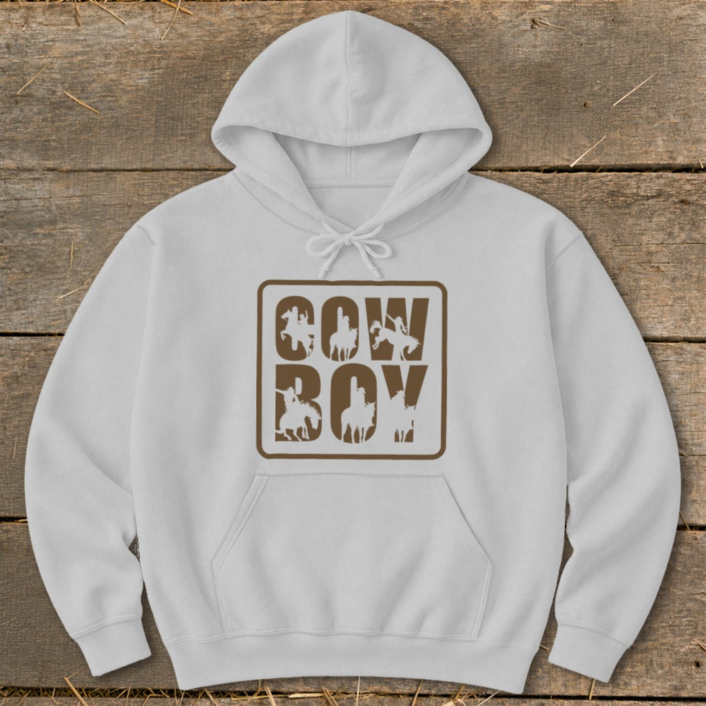 White hoodie with "COW BOY" text and cowboy silhouettes in a brown square.