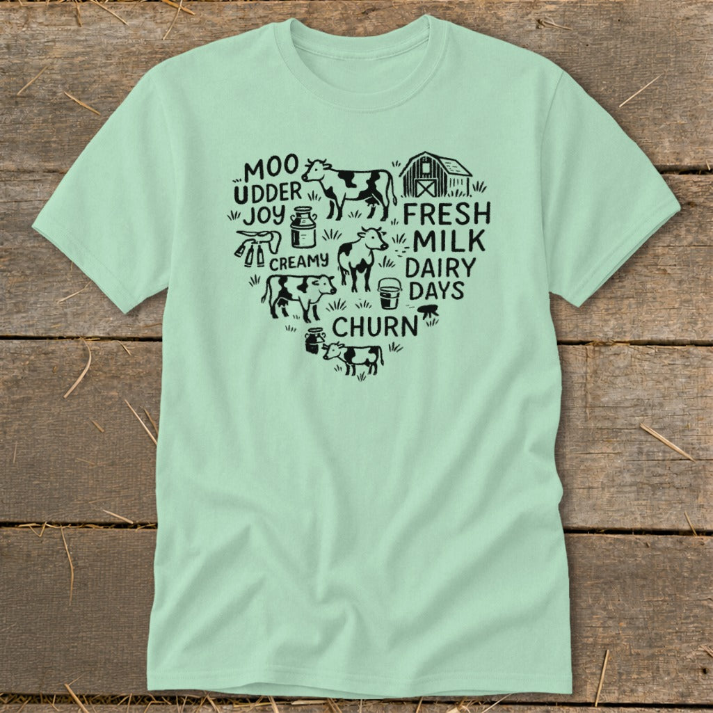Heart-shaped graphic with cows, barn, milk cans, and text about dairy.