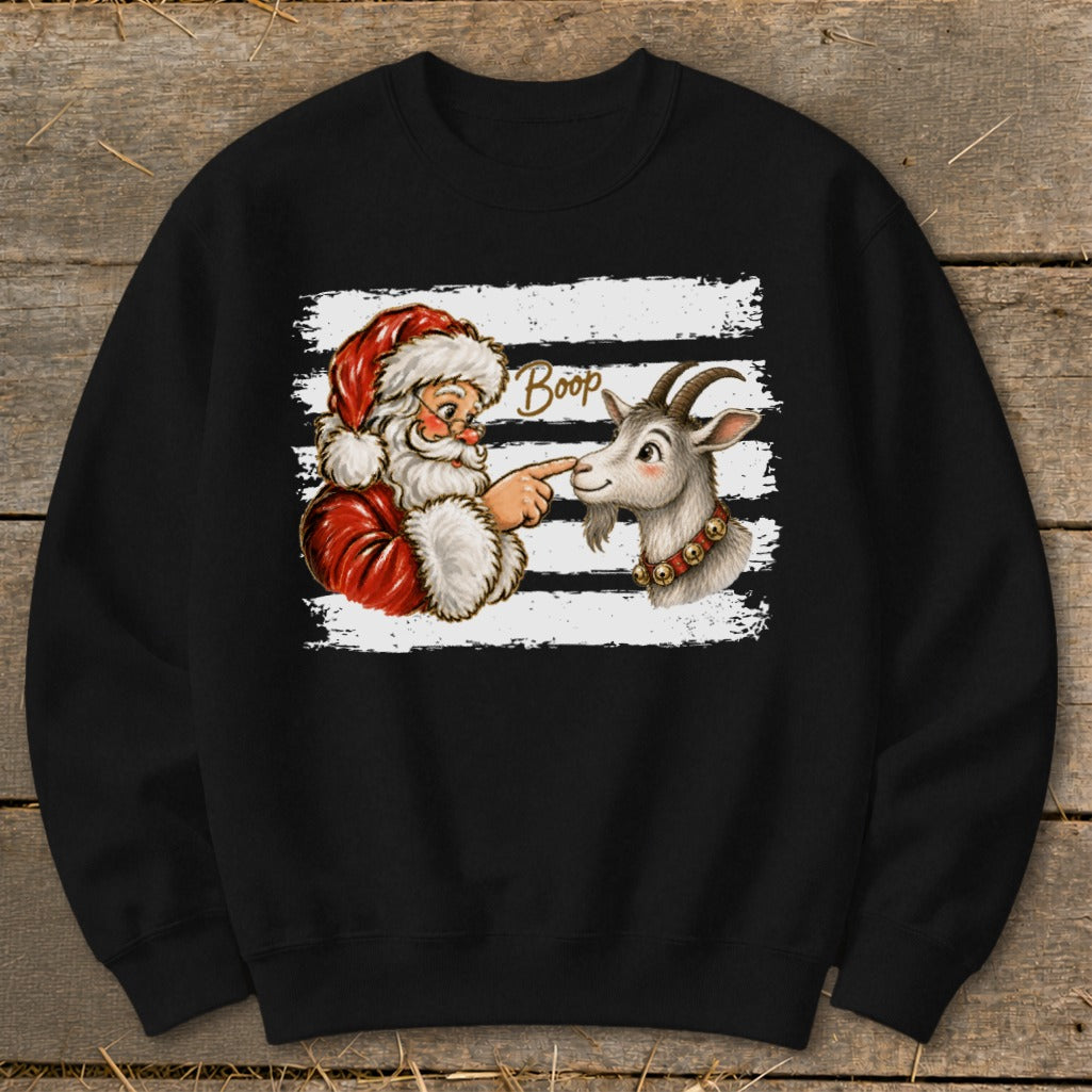 Santa touching a goat's nose with text "Boop" on a black sweatshirt.