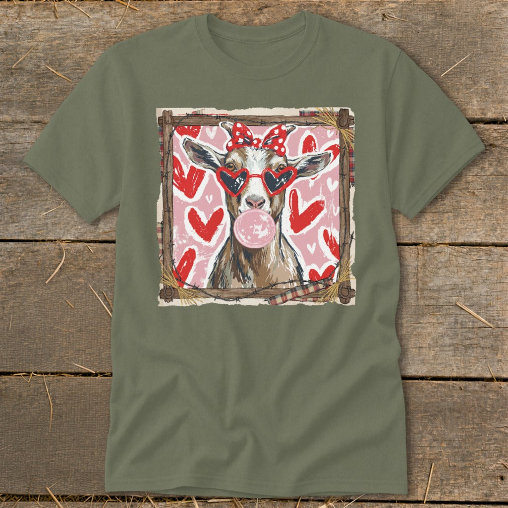 Goat wearing heart sunglasses and red bow blows bubblegum against pink heart background.