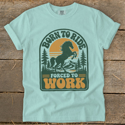 Light blue t-shirt with "Born to Ride" and "Forced to Work" graphic featuring a horse.