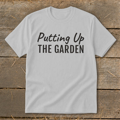 Light gray t-shirt with black text "Putting Up THE GARDEN"