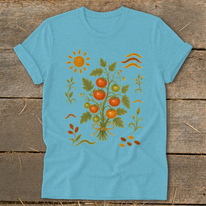 Light blue t-shirt with a sun, tomato plant, and wavy lines illustration.