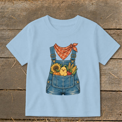 Light blue t-shirt with denim overalls graphic and fall harvest design.