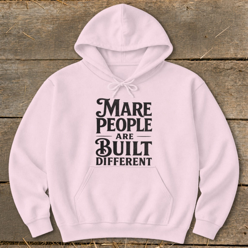 Light pink hoodie with black text reading "Mare People Are Built Different".
