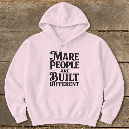 Light pink hoodie with black text reading "Mare People Are Built Different".