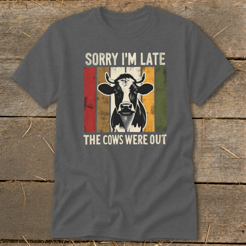 Dark gray t-shirt with a cow graphic and text "Sorry I'm Late The Cows Were Out".
