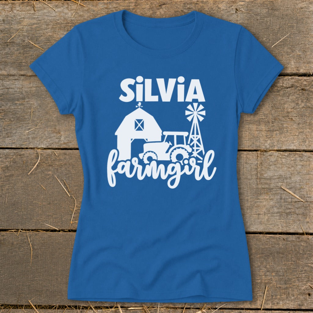 Blue t-shirt with "Silvia farmgirl" text and farm graphics.