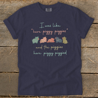 Navy t-shirt with text: "I was like 'here piggy piggies' and the piggies here piggy piggied"