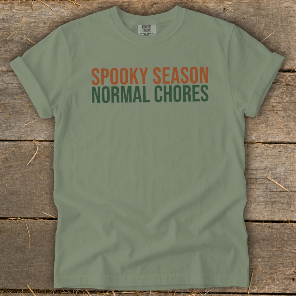 Olive green t-shirt with "Spooky Season" and "Normal Chores" text.