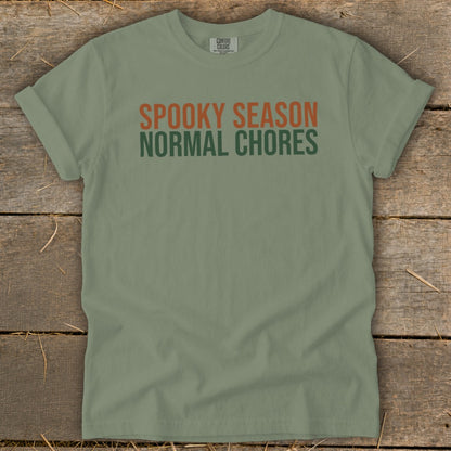 Olive green t-shirt with "Spooky Season" and "Normal Chores" text.