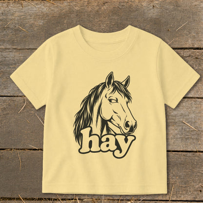 Yellow t-shirt with black horse graphic and "hay" text.