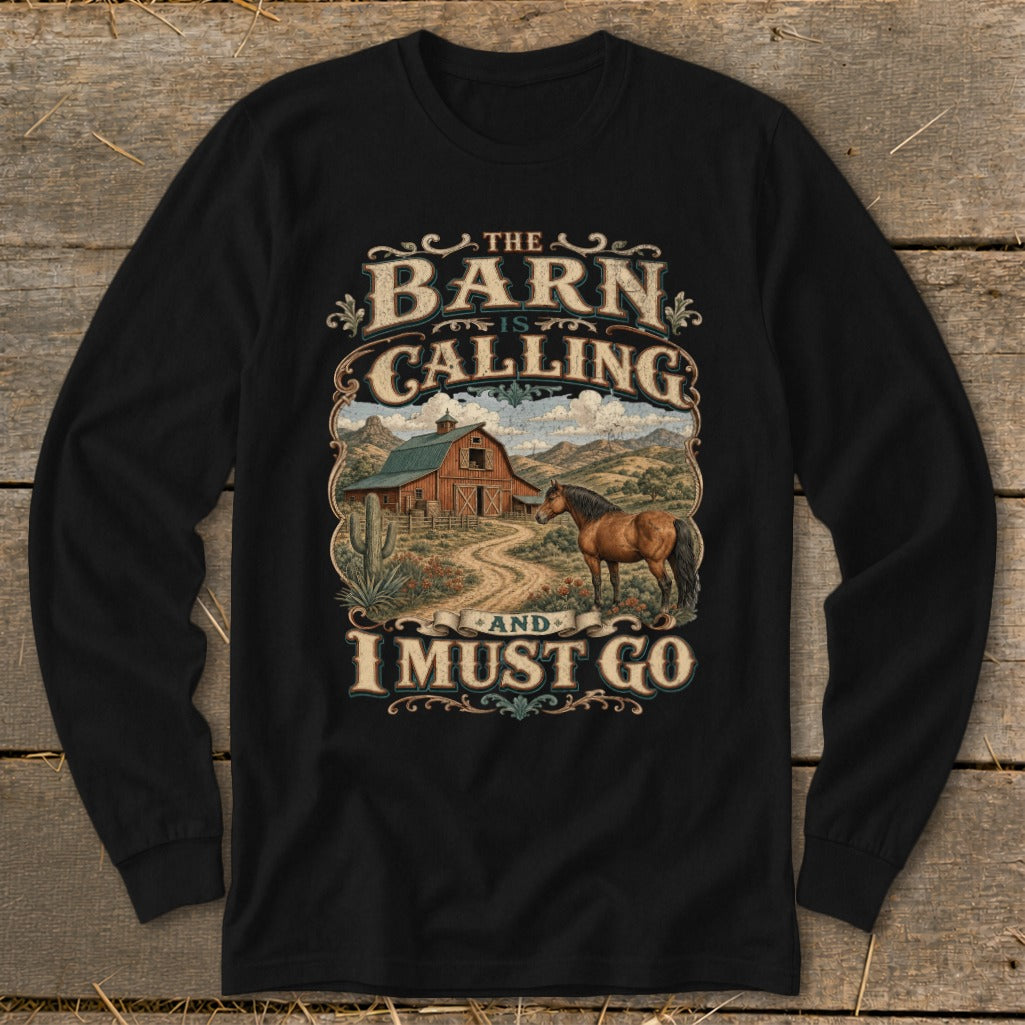 Black long sleeve shirt with barn, horse, cactus, and text "The Barn is Calling and I Must Go."