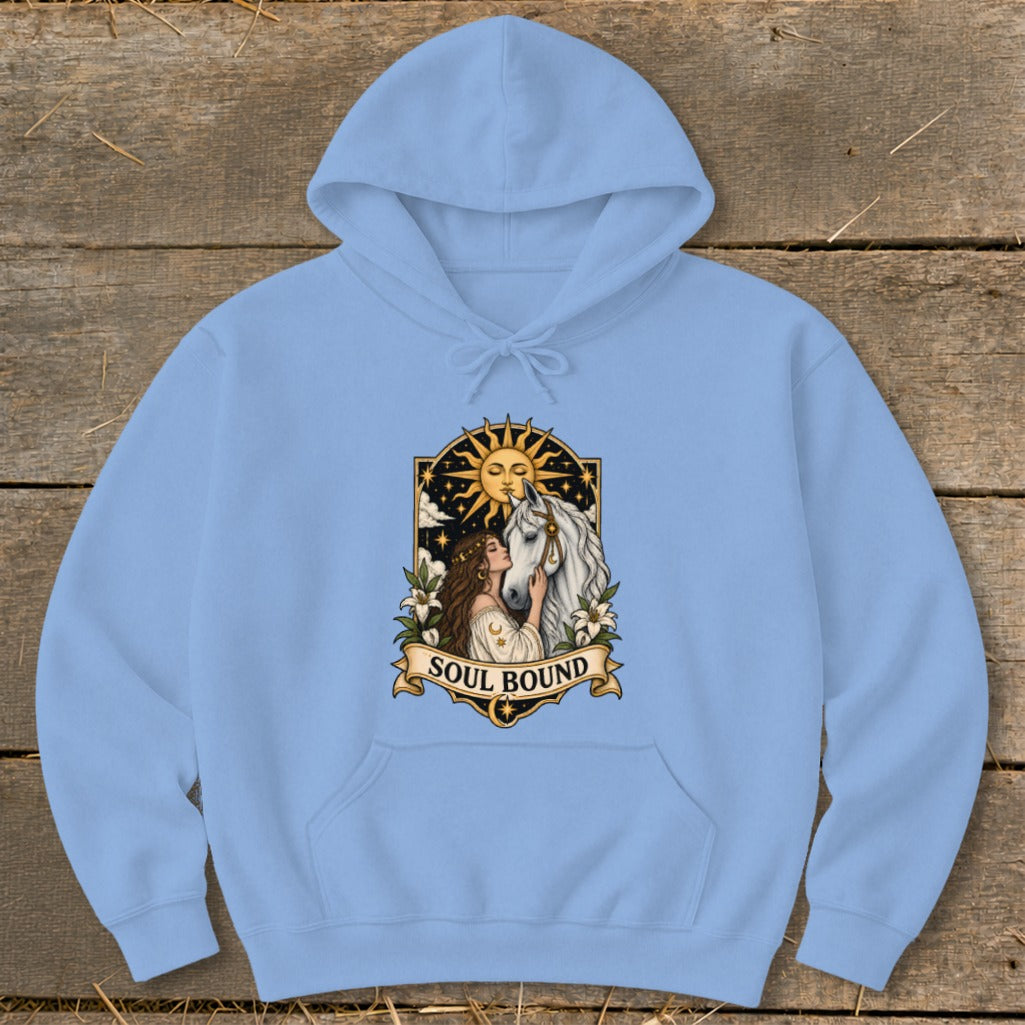 Light blue hoodie with "Soul Bound" text and woman embracing a horse with sun.
