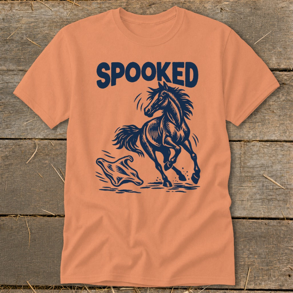Orange t-shirt with "SPOOKED" text and a startled horse illustration.