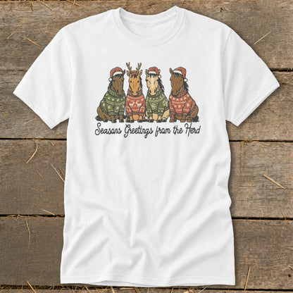 Four horses wearing Christmas sweaters and Santa hats, with text "Seasons Greetings from the Herd".