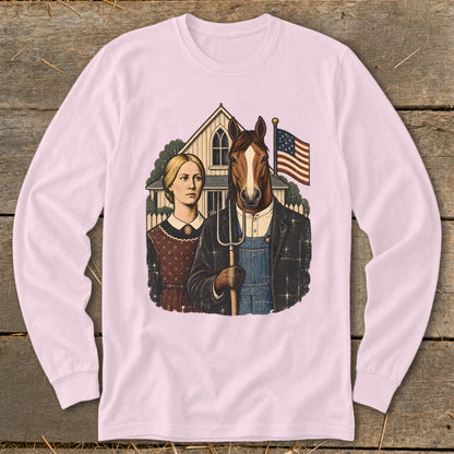 Light pink long-sleeve shirt featuring a parody American Gothic graphic with a woman and a horse holding a pitchfork.