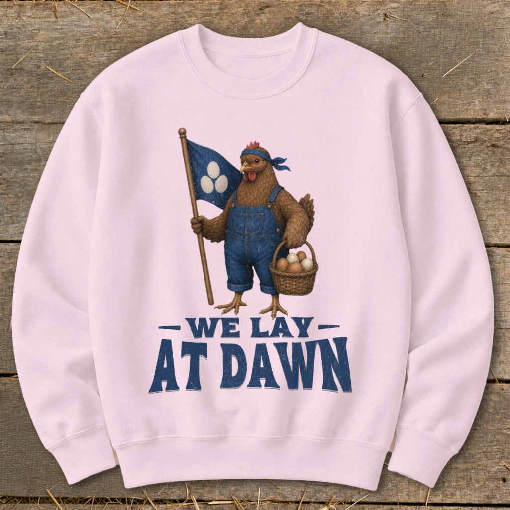 Pink sweatshirt with chicken graphic holding flag and basket; text reads "We Lay At Dawn".