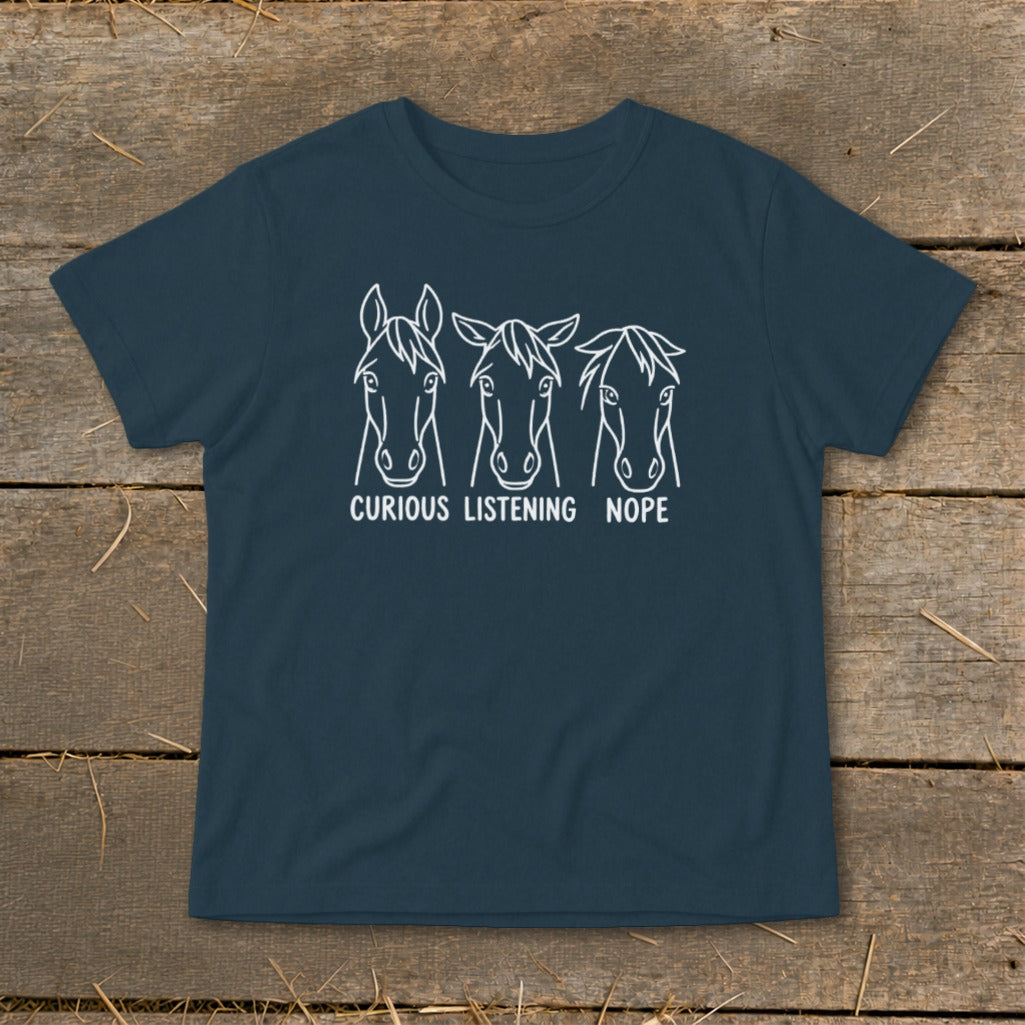Dark blue t-shirt featuring a white line drawing of three horses with the text curious, listening, nope.