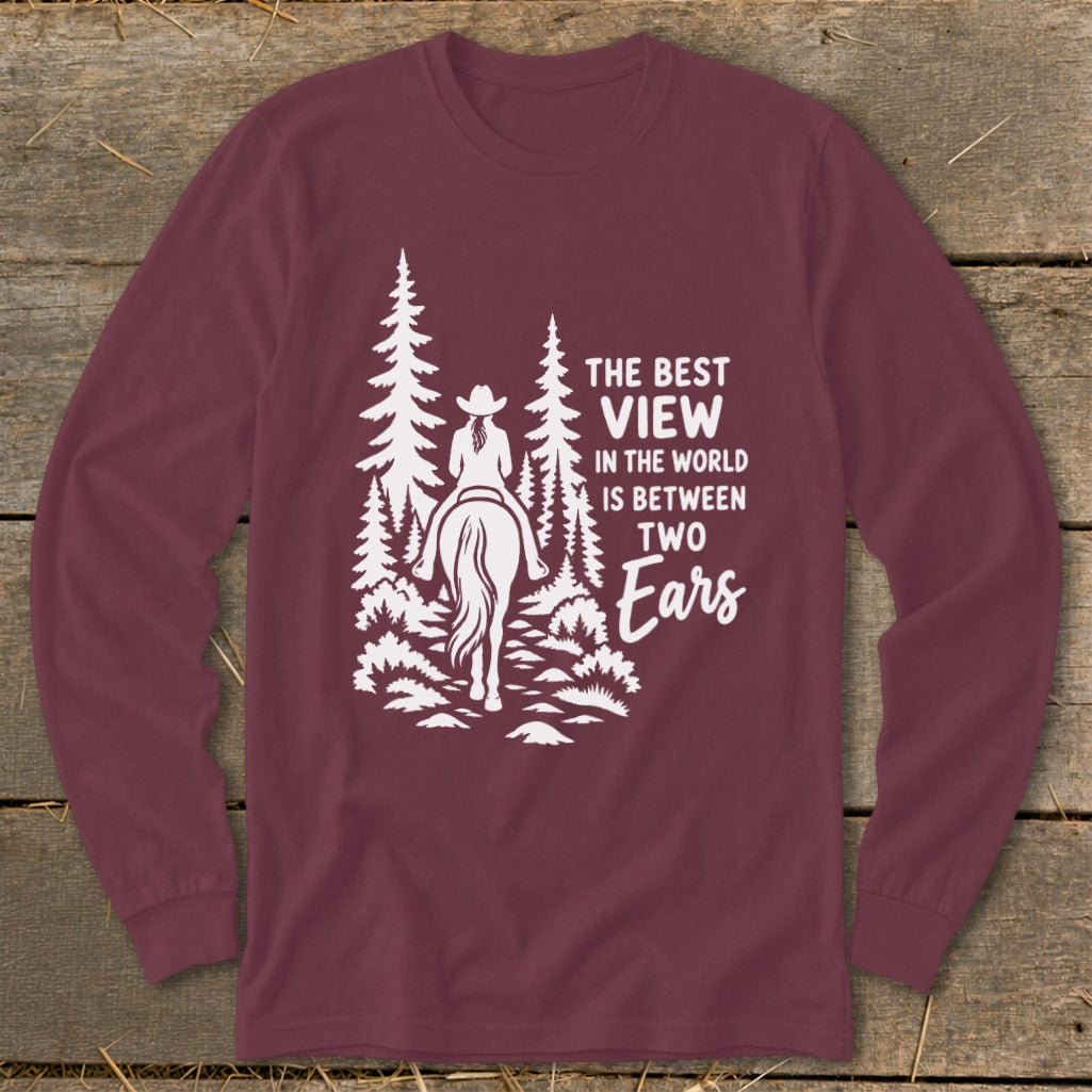 Maroon long-sleeve t-shirt with a white graphic of a horseback rider and pine trees.
