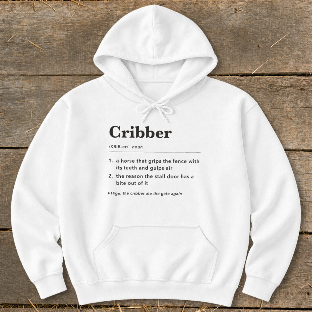 A white hooded sweatshirt with the dictionary definition of the word "Cribber" printed on the chest.