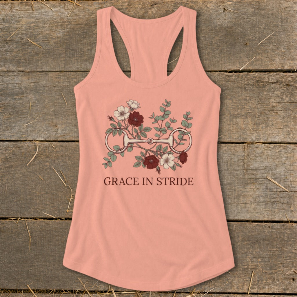 Peach tank top with horse bit and floral design, reads "Grace in Stride".