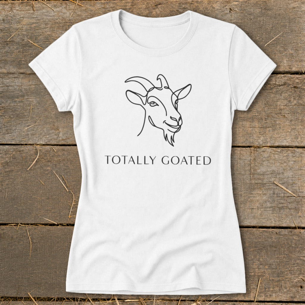 White t-shirt with line drawing of a goat and text "TOTALLY GOATED".
