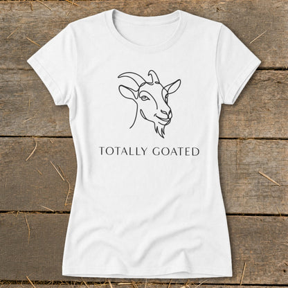White t-shirt with line drawing of a goat and text "TOTALLY GOATED".