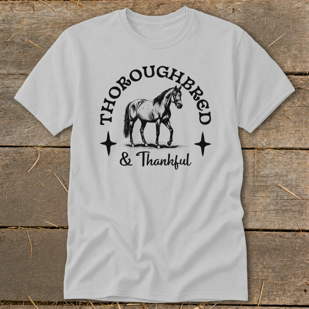 Gray t-shirt with a drawing of a horse and the text "Thoroughbred & Thankful".