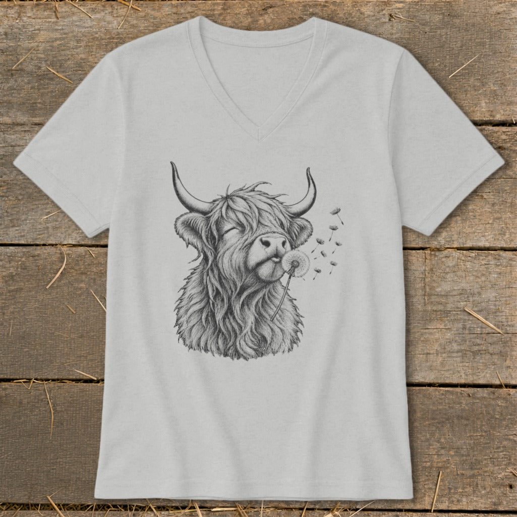 T-shirt with a drawing of a Highland cow blowing a dandelion.