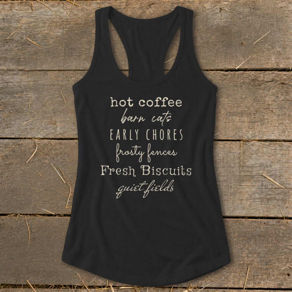 Black racerback tank top with "hot coffee barn cats early chores frosty fences Fresh Biscuits quiet fields" text.