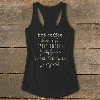 Black racerback tank top with "hot coffee barn cats early chores frosty fences Fresh Biscuits quiet fields" text.