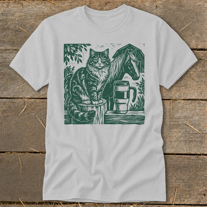 Linocut graphic of cat, horse, and mug on a t-shirt.