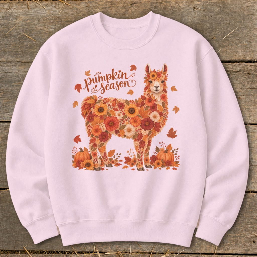 Pink sweatshirt with a llama made of flowers and leaves, text reads "Pumpkin Season".
