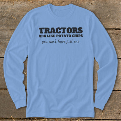 Light blue long sleeve shirt with black text: "Tractors are like potato chips you can't have just one."
