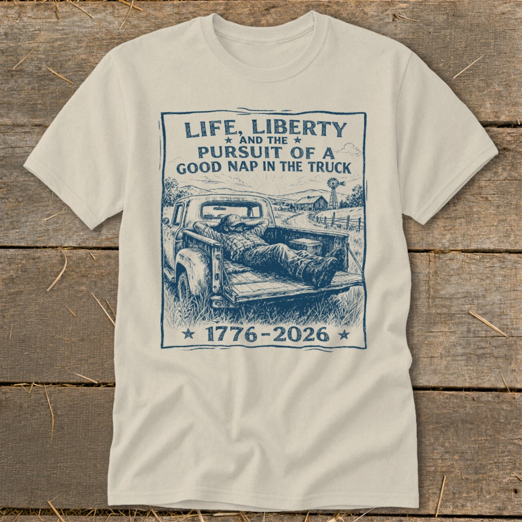 T-shirt with text "Life, Liberty and the Pursuit of a Good Nap in the Truck" and a man napping in a truck.
