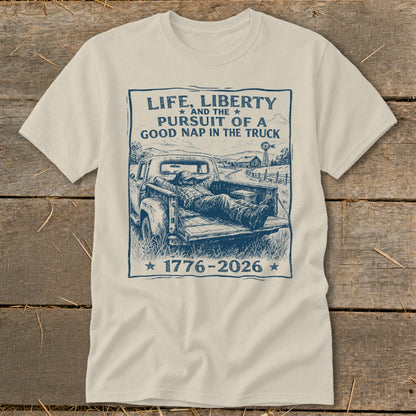 T-shirt with text "Life, Liberty and the Pursuit of a Good Nap in the Truck" and a man napping in a truck.