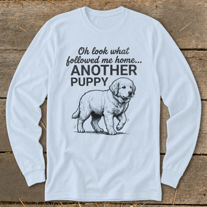 Long sleeve light blue t-shirt with illustration of a walking puppy and text.