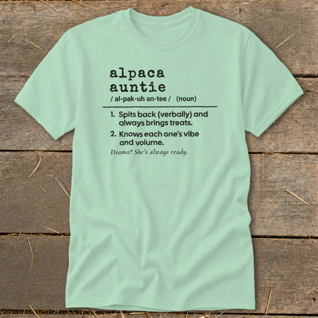 Light green t-shirt with "alpaca auntie" definition and descriptive phrases.