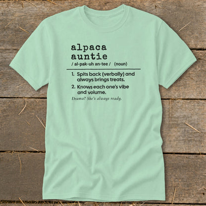 Light green t-shirt with "alpaca auntie" definition and descriptive phrases.
