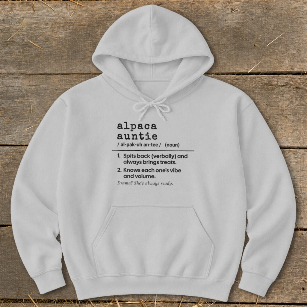 White hoodie with text defining "alpaca auntie" and its characteristics.